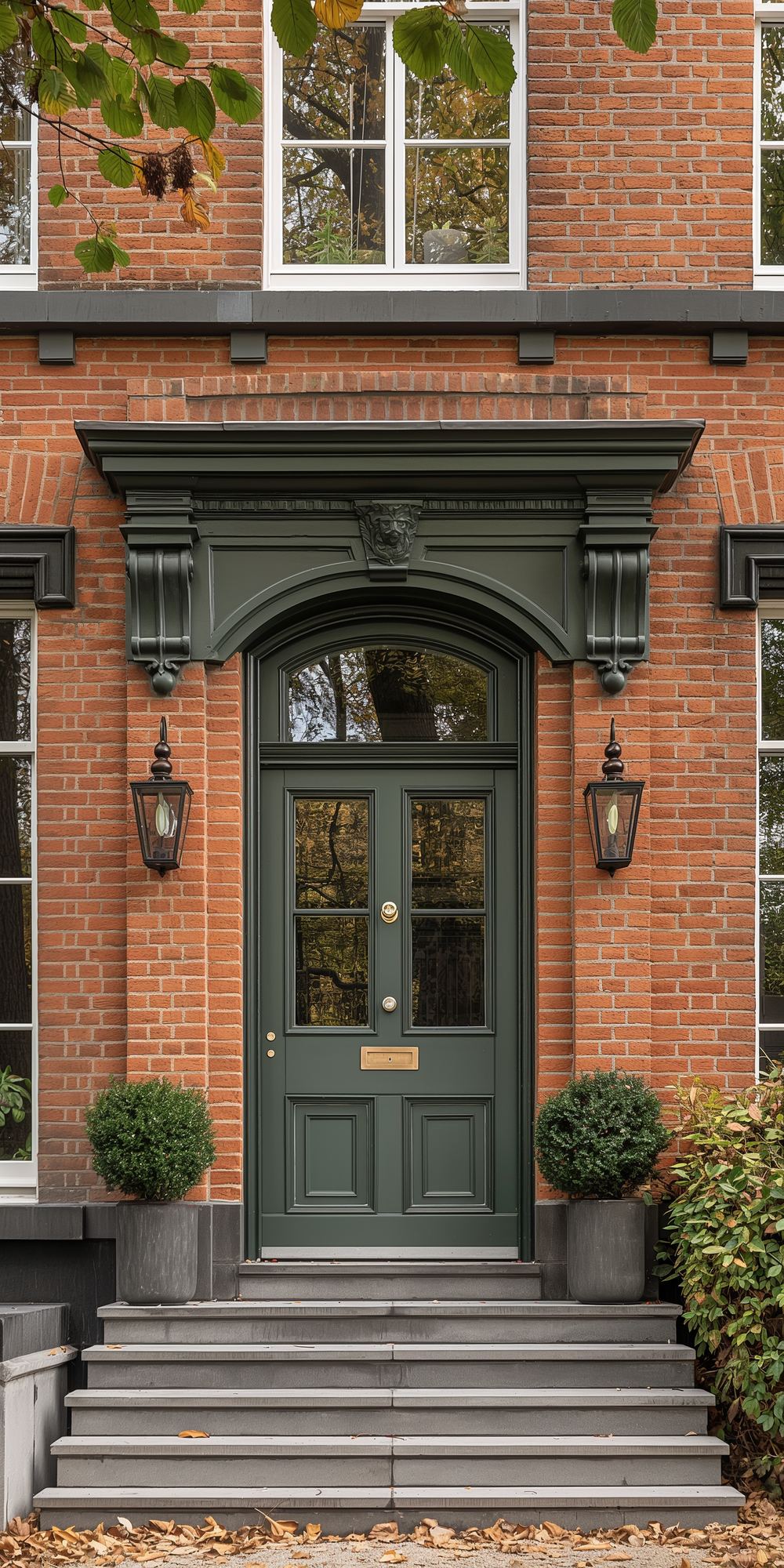 Green front door with a fanlight above