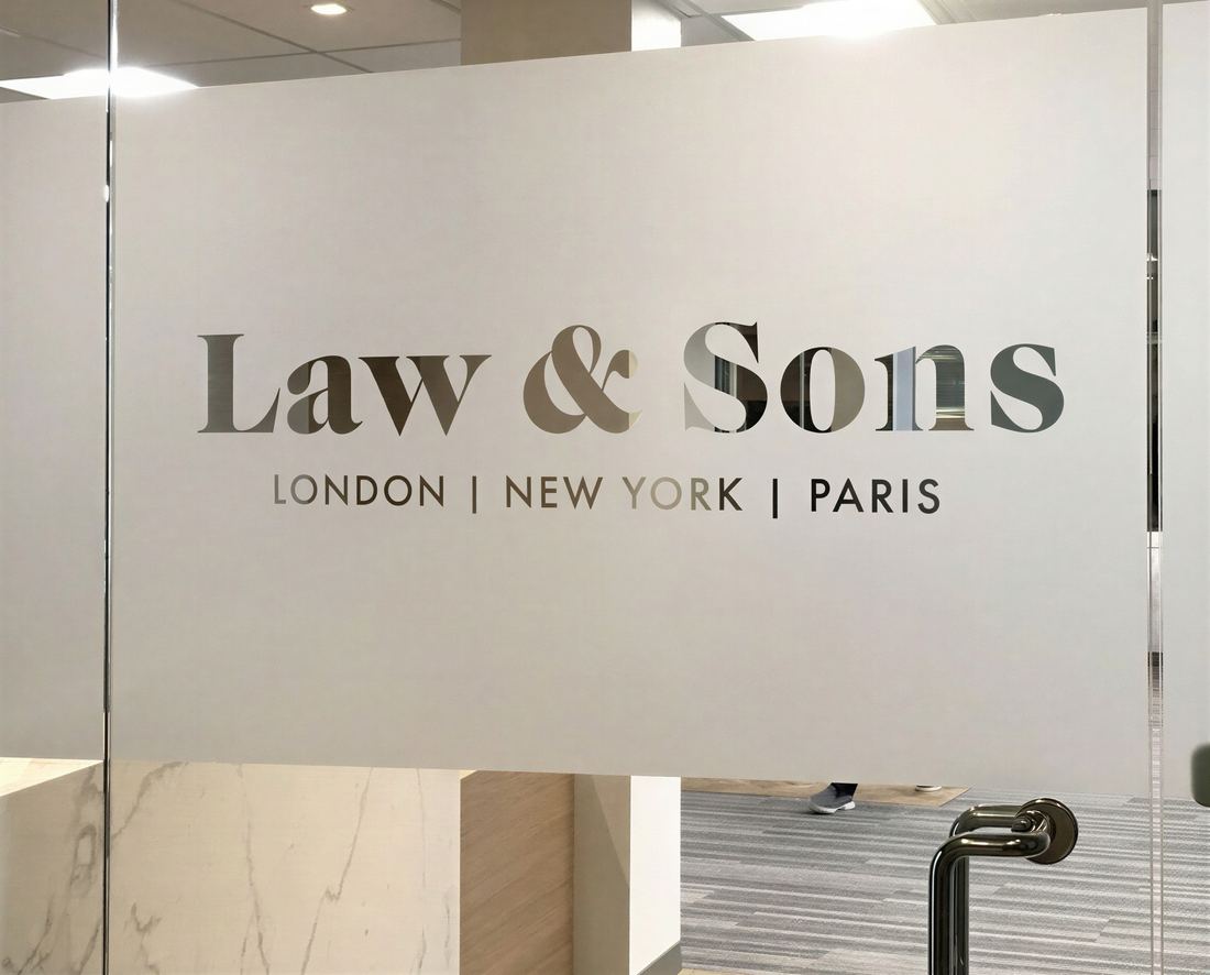 Frosted glass panel with a Law and Sons logo left clear