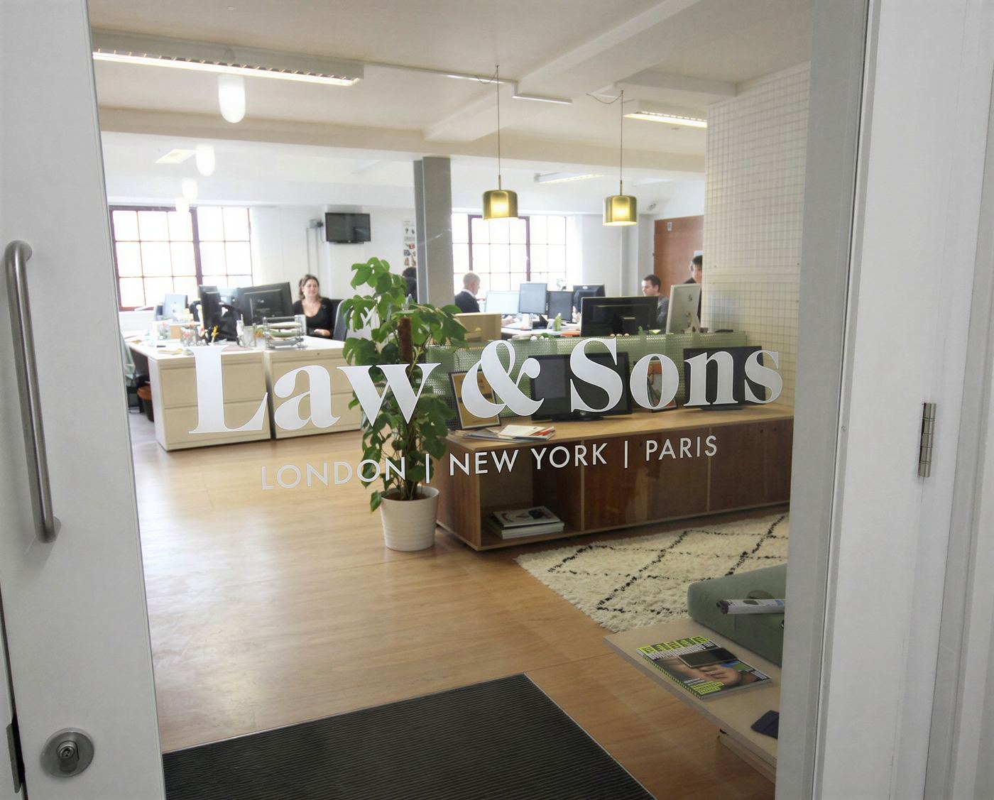 Frosted glass office door with a cut-out logo