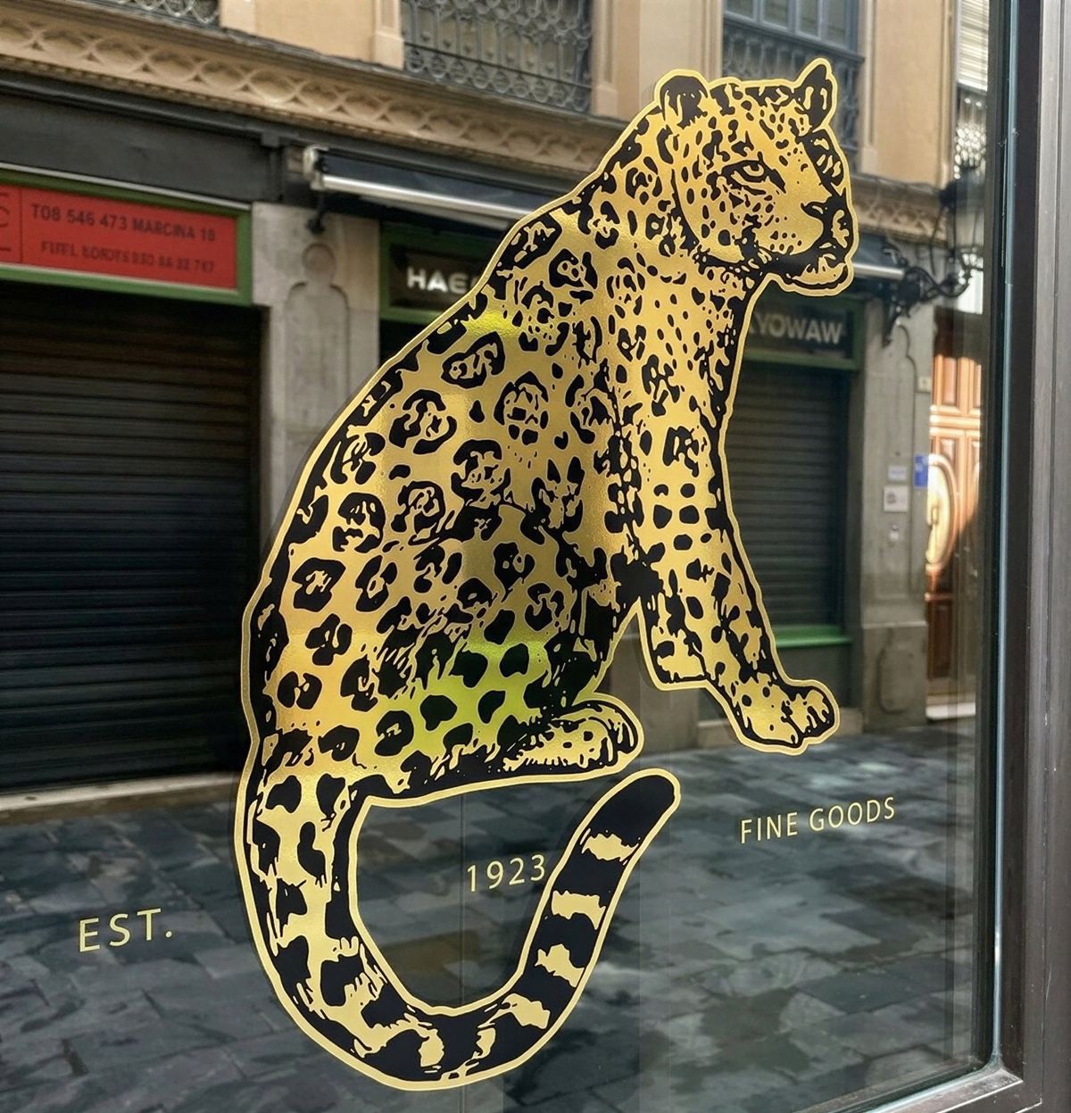 Shop window with a large chrome gold leopard
